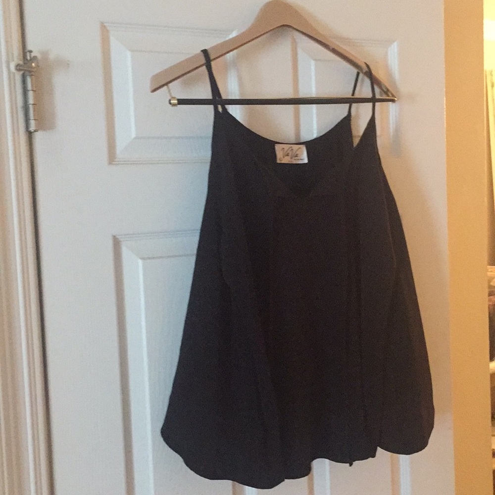 Fun & flirty black top. Great for all seasons!